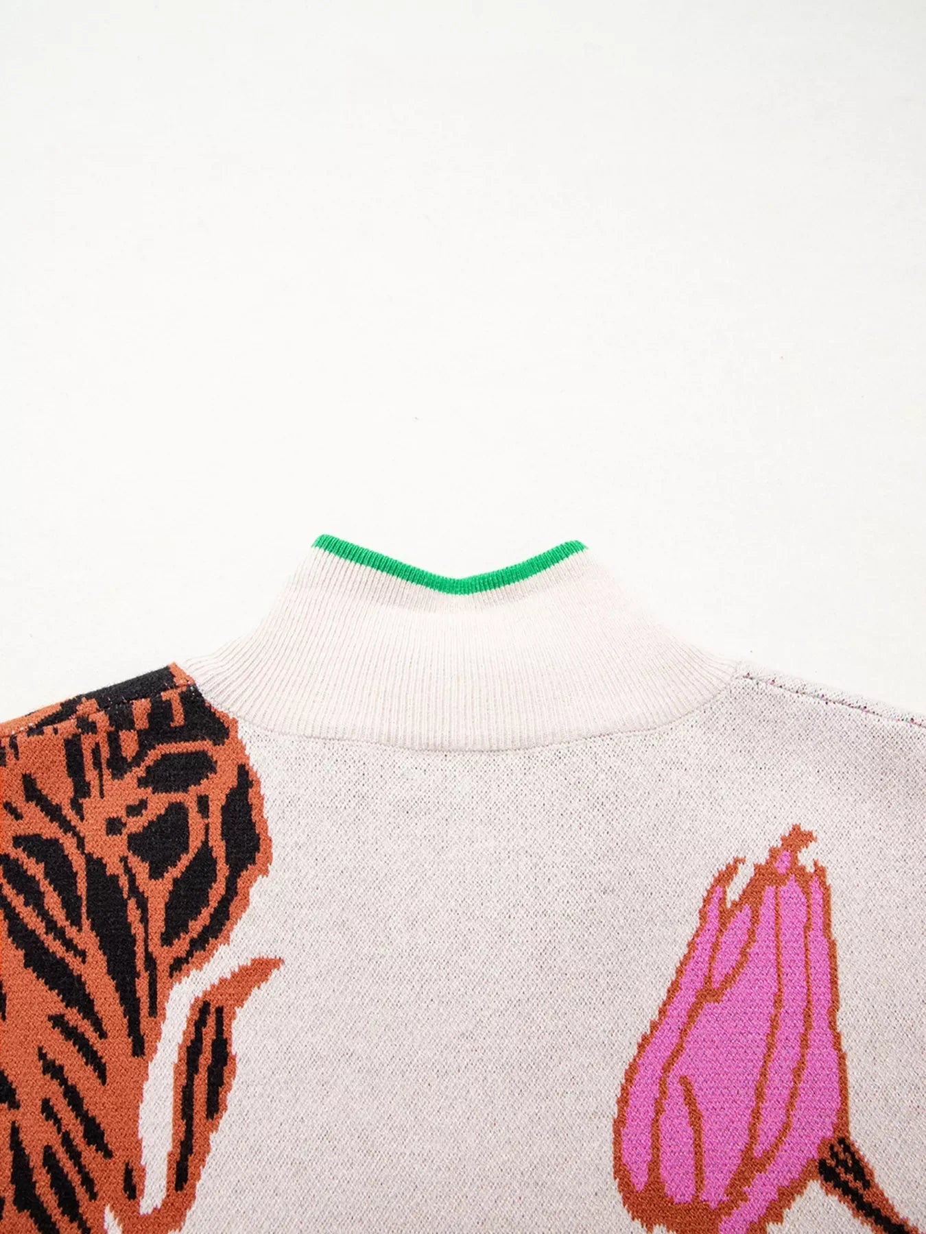 White and pink floral knit quarter zip sweater with green collar