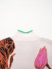 White and pink floral knit quarter zip sweater with green collar