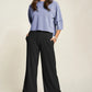 Woman in lavender top and Davi & Dani wide-leg pants