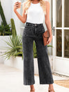 High-waisted dark wash wide-leg jeans with five-pocket design and rolled cuffs