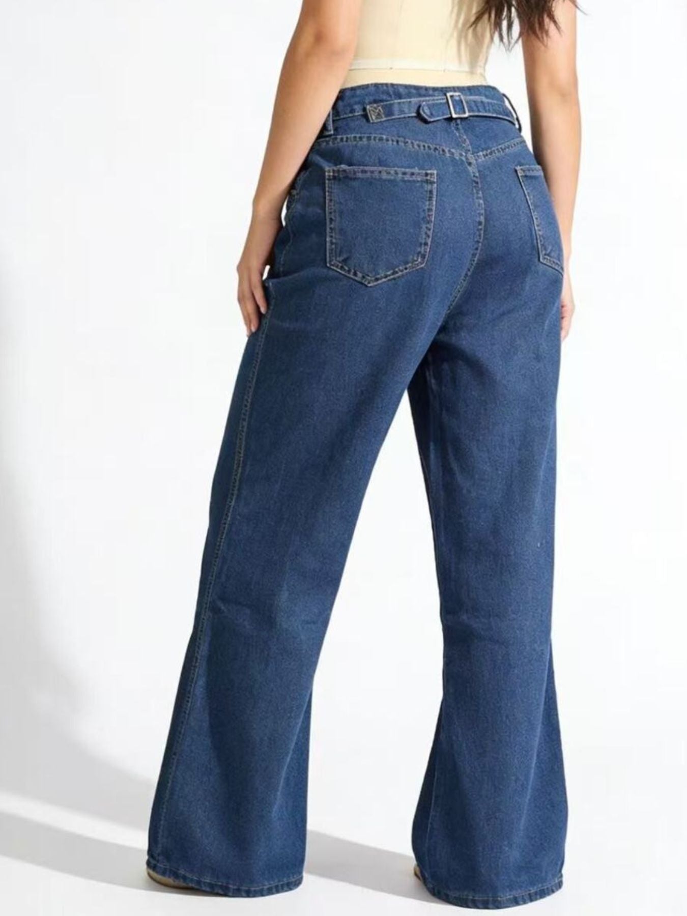 Back view of Daverri high-waisted wide leg blue denim flare jeans with belt loops and pockets