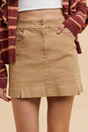 Khaki high-waisted mini skirt with front pockets, pleats, and slit details