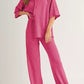 Vibrant pink waffle-knit button-up shirt and wide-leg pants set
