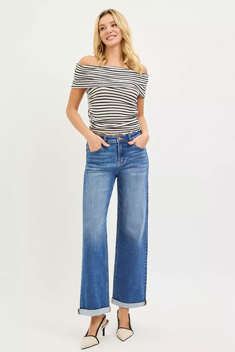 Woman in off-shoulder striped top and RISEN high-rise relaxed fit ankle straight cuff jeans