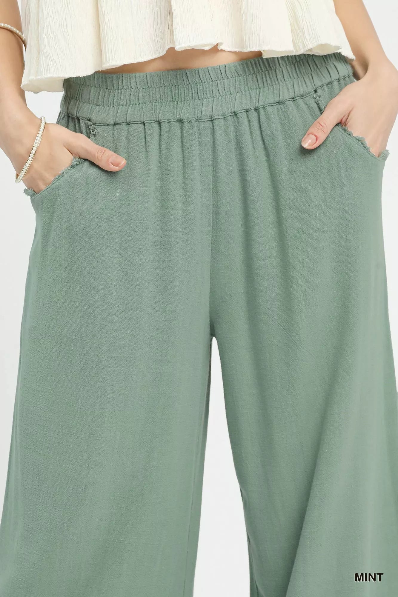 Umgee mint linen wide-leg cropped pants with lace trim and frayed hem