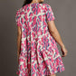 Umgee Full Size Abstract Print Pleat Detail Short Sleeve V-Neck Tiered Dress Plus Size