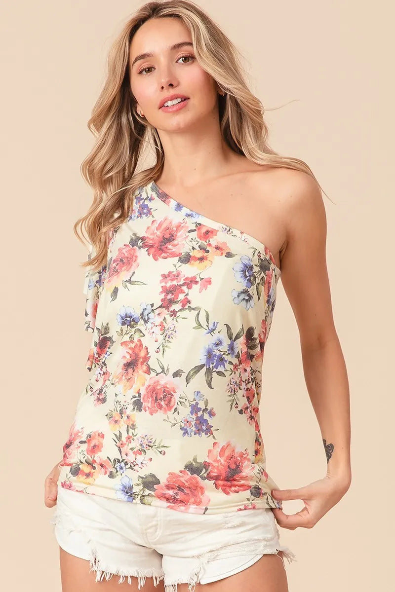 BiBi floral printed jersey knit one-shoulder ruffle sleeve top in cream with pink, red, and purple blossoms
