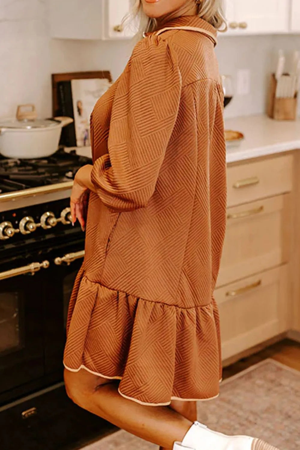 Cozy rust-colored ruffled hem zip front texture dress with herringbone pattern and cream trim