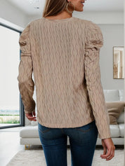 Beige cable knit V-neck puff sleeve sweater with round neckline