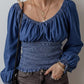 Blue denim blouse with puffed sleeves and smocked waist top