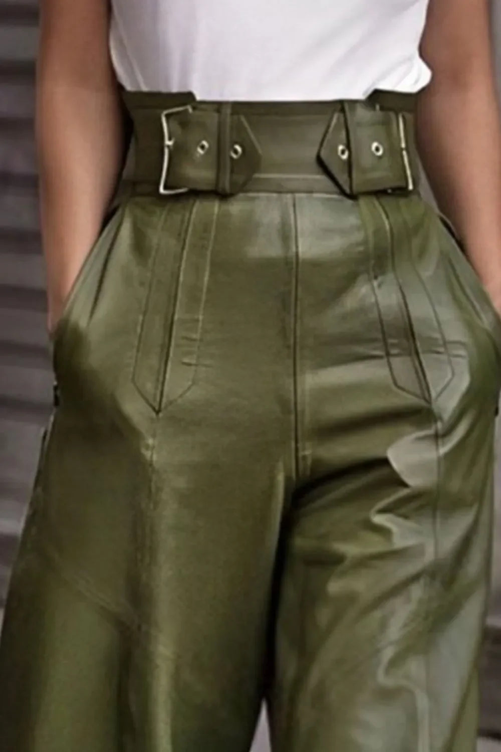 Olive green high-waisted faux leather wide flare pants with silver buckles