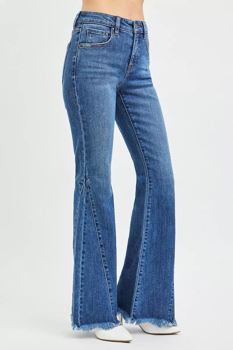 RISEN mid-rise flare jeans in blue denim with frayed hem and five-pocket design