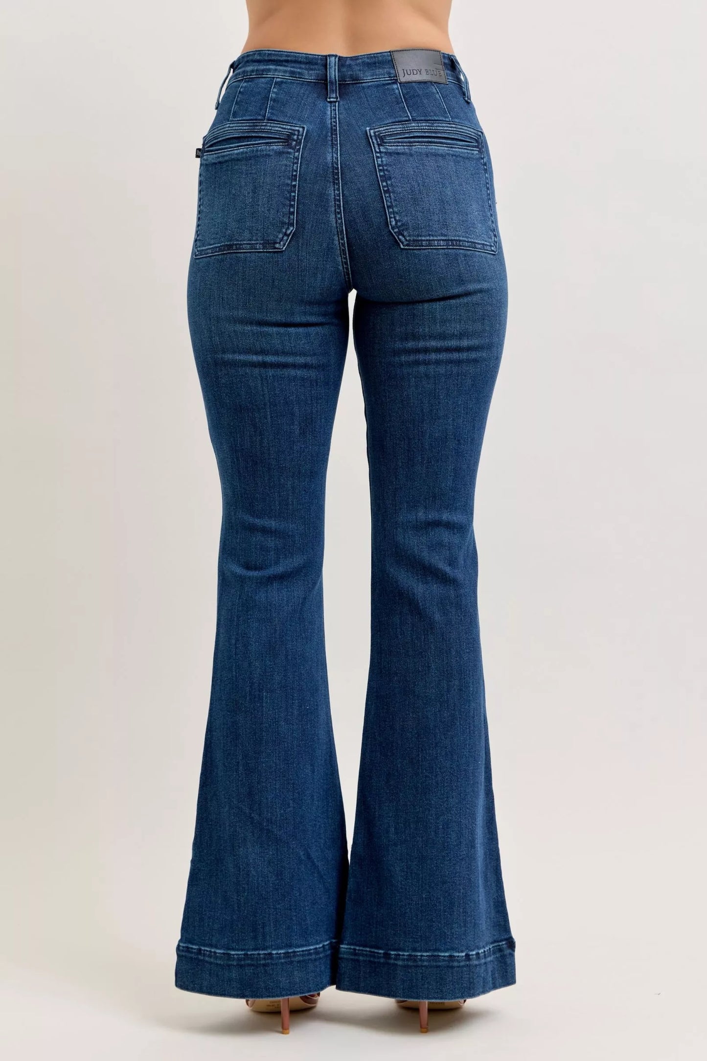 Back view of Judy Blue high-waisted flare jeans in blue denim with classic pockets