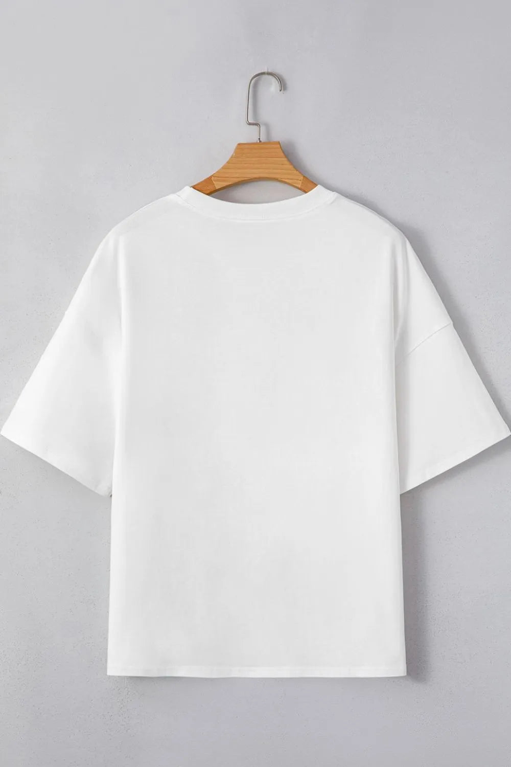 White oversized drop shoulder half sleeve loose tee with layered patched graphic