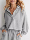 Gray Exposed Seam Dropped Shoulder Hoodie with half-zip front and ribbed cuffs
