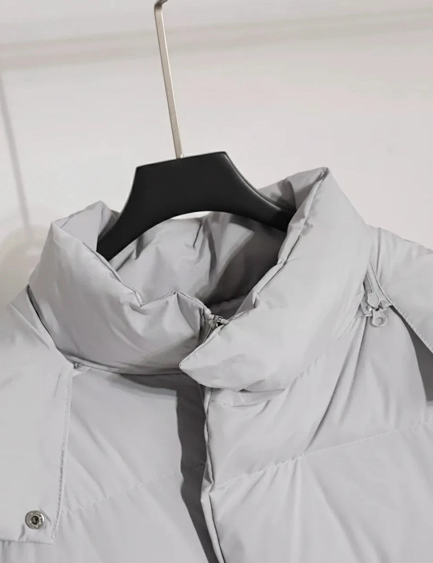 Light gray hooded puffer jacket with pockets on wooden hanger