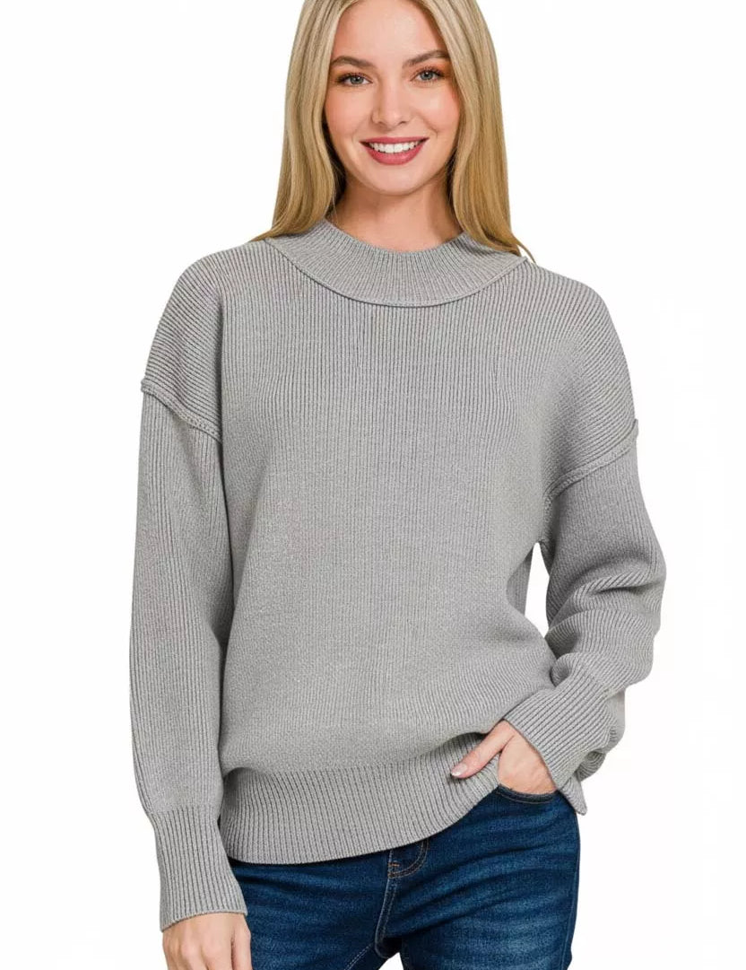Grey cable knit mock neck sweater with long sleeves