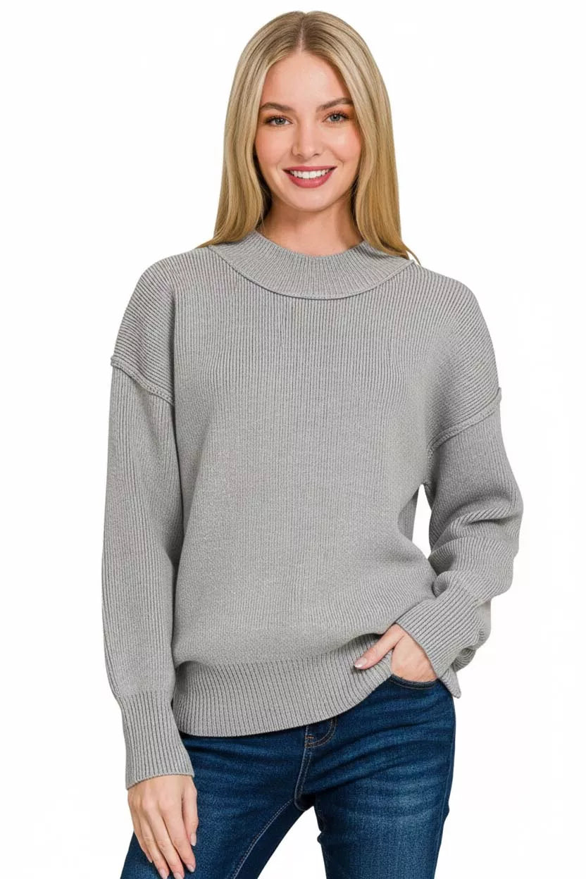 Grey cable knit mock neck sweater with long sleeves