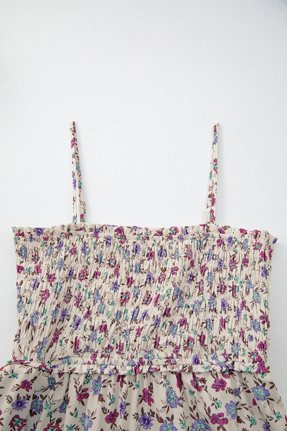 Delicate beige floral smocked bodice top with thin straps on multicolour bohemian sundress