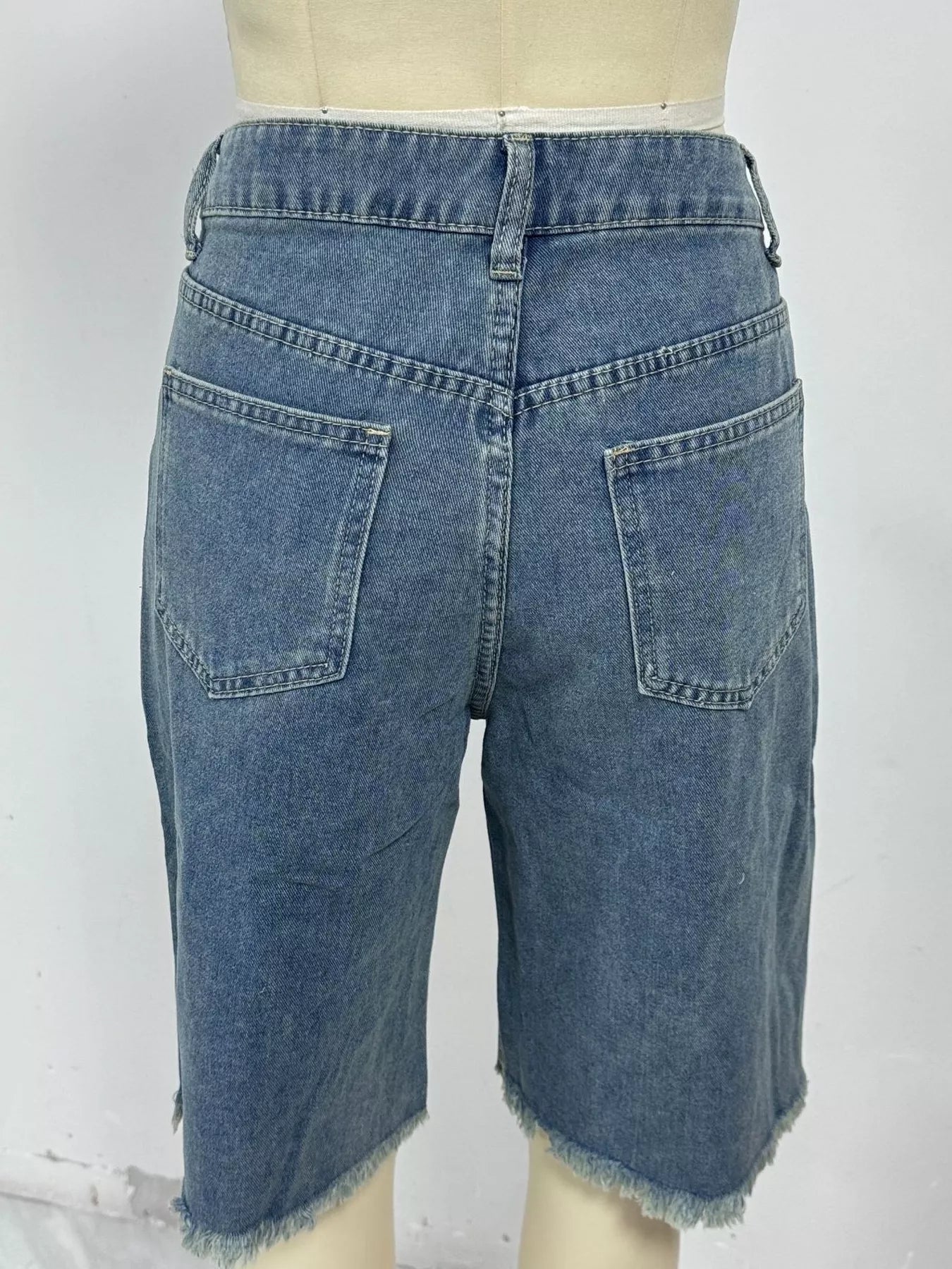 Frayed hem relaxed fit denim shorts back view with classic pockets