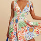Daverri V-neck sleeveless smocked waist printed mini dress, colorful patchwork