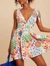 Daverri V-neck sleeveless smocked waist printed mini dress, colorful patchwork