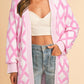 Pink rhombus pattern open front pocketed knit cardigan with ribbed cuffs