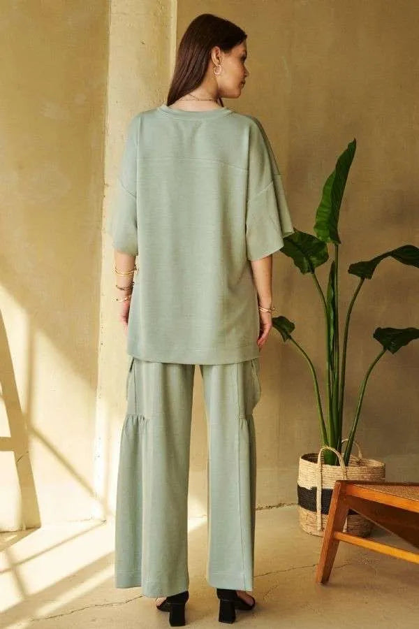 Sage green oversized top with ruched wide-leg pants by Davi & Dani