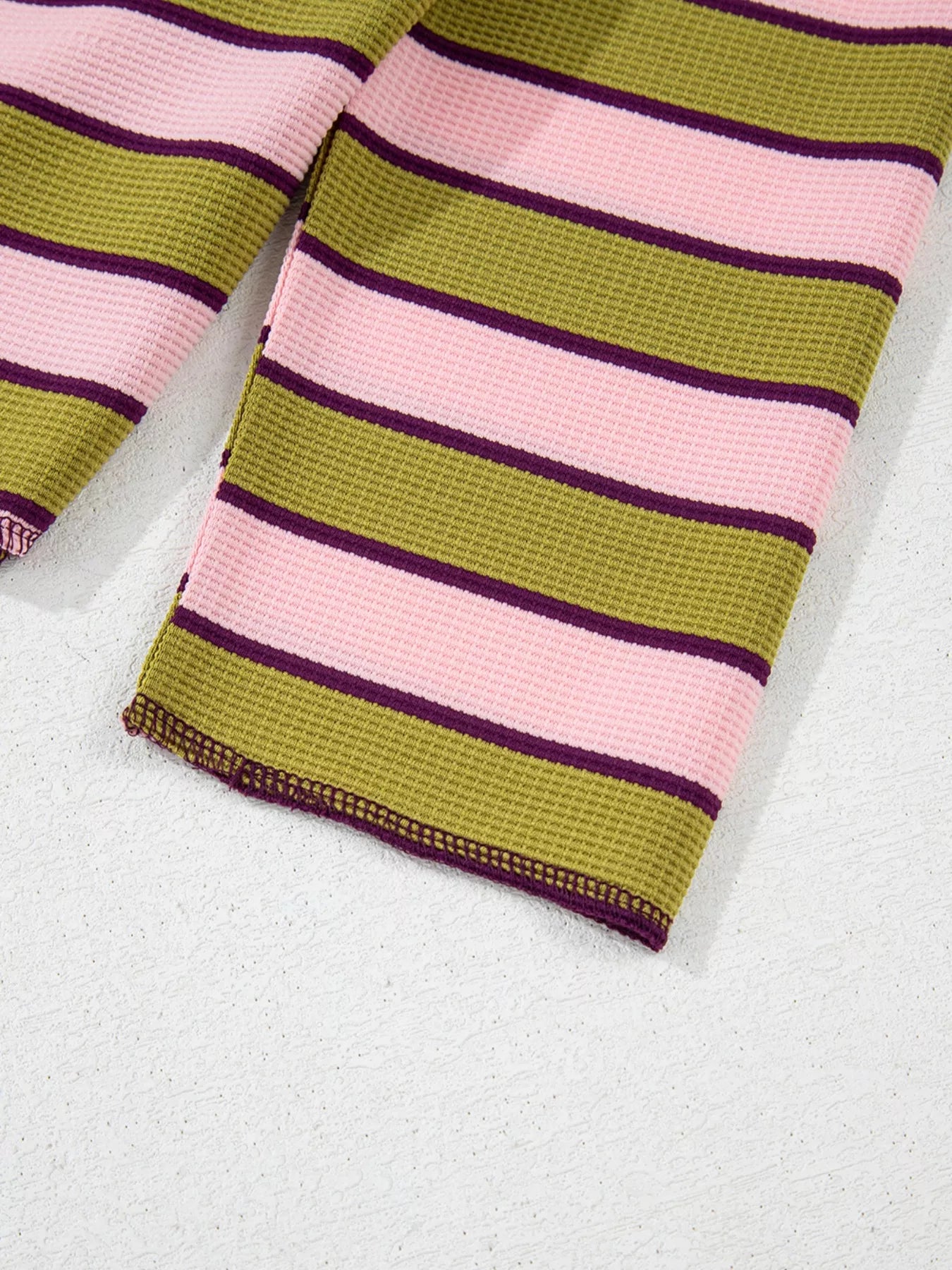 Striped knit wrist warmer in olive green, pink, purple from Daverri Fashions