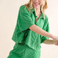 Green textured pajama set with checkerboard pattern and headband