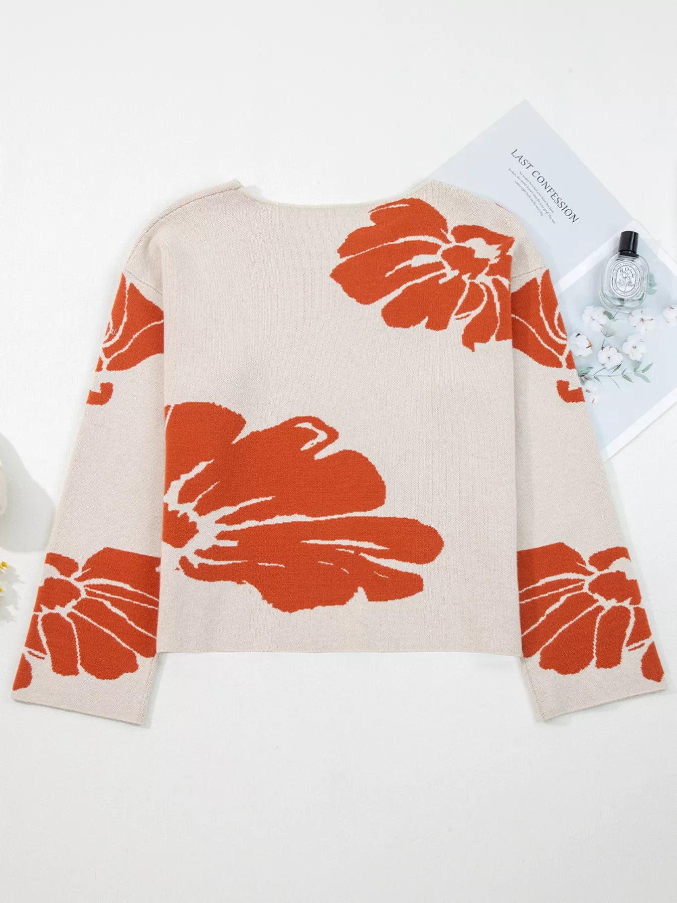 Boho oversized knit sweater for women with beige base and bold orange floral patterns