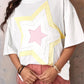 White oversized drop shoulder tee with layered star graphic in yellow and pink