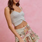 Light gray textured crochet crop top with thin straps over SO ME floral print skirt