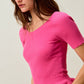 Vibrant pink SO ME ribbed knit peplum top with short sleeves