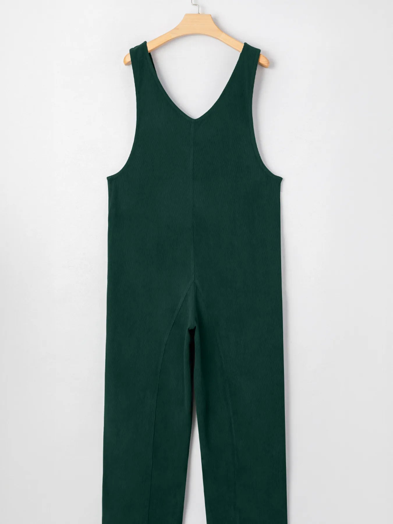 Dark green womens v-neck sleeveless corduroy jumpsuit on hanger