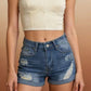 Cream strapless crop top with Daverri distressed denim shorts