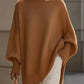 Cozy camel-colored oversized batwing sleeve knit poncho with ribbed cuffs