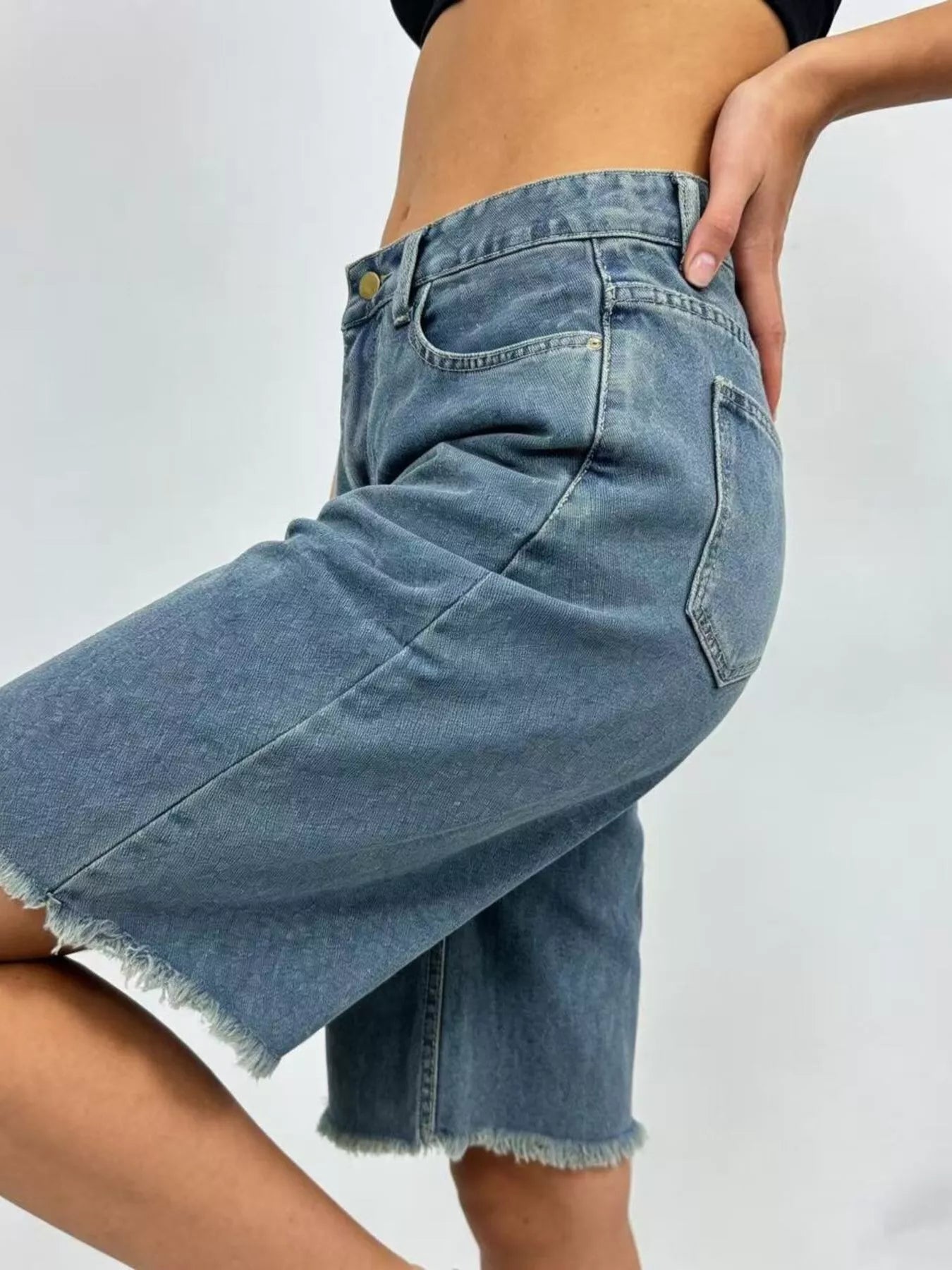 Frayed hem relaxed fit denim skirt in faded blue wash