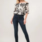 Black high-waisted slim fit jeans with button fly and floral top