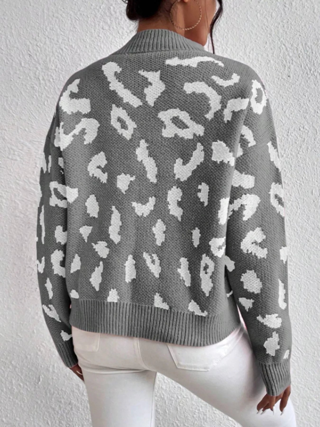 Grey and white leopard print mock neck sweater with ribbed cuffs