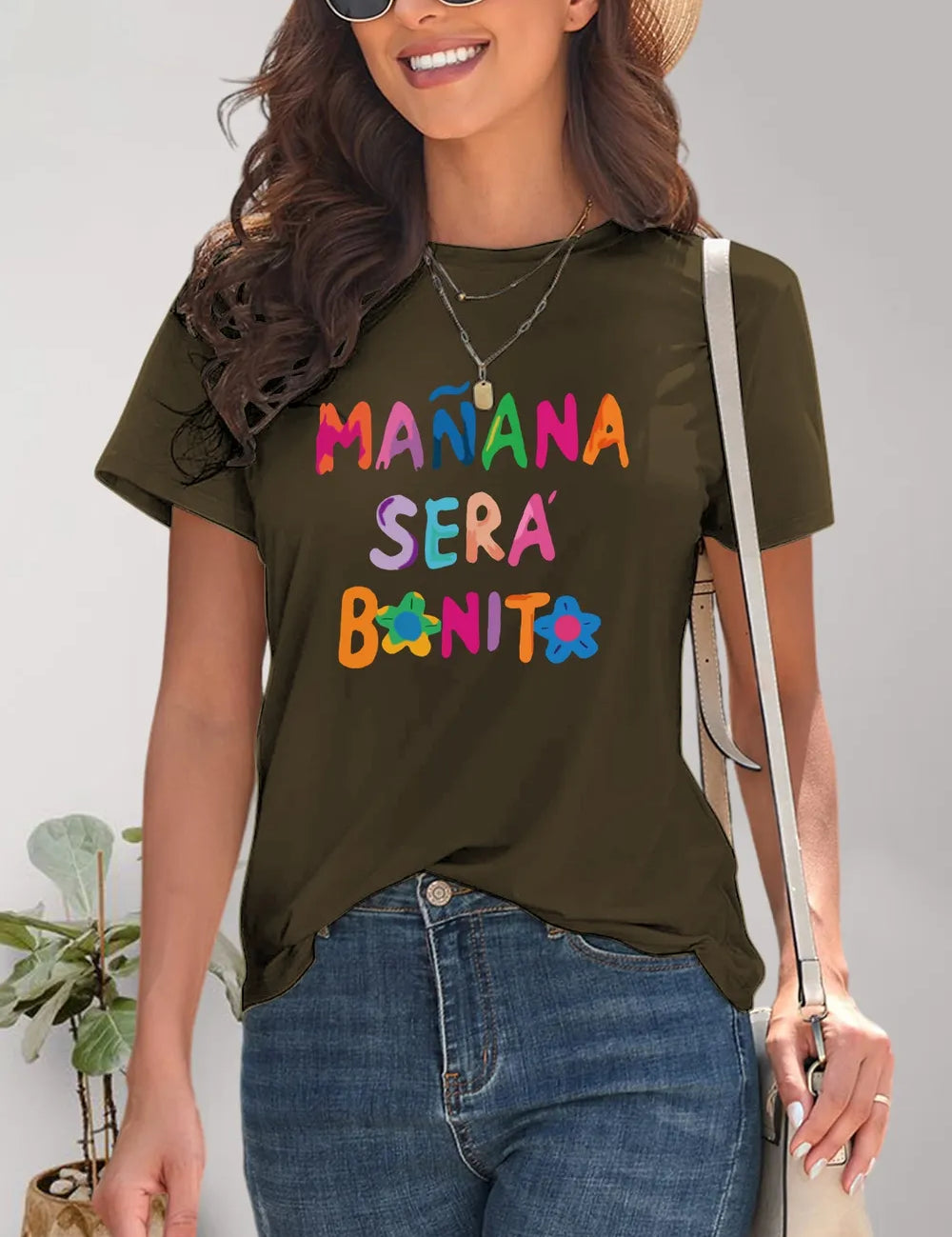 Olive green ruffled short-sleeve t-shirt with colorful lettering and floral accents