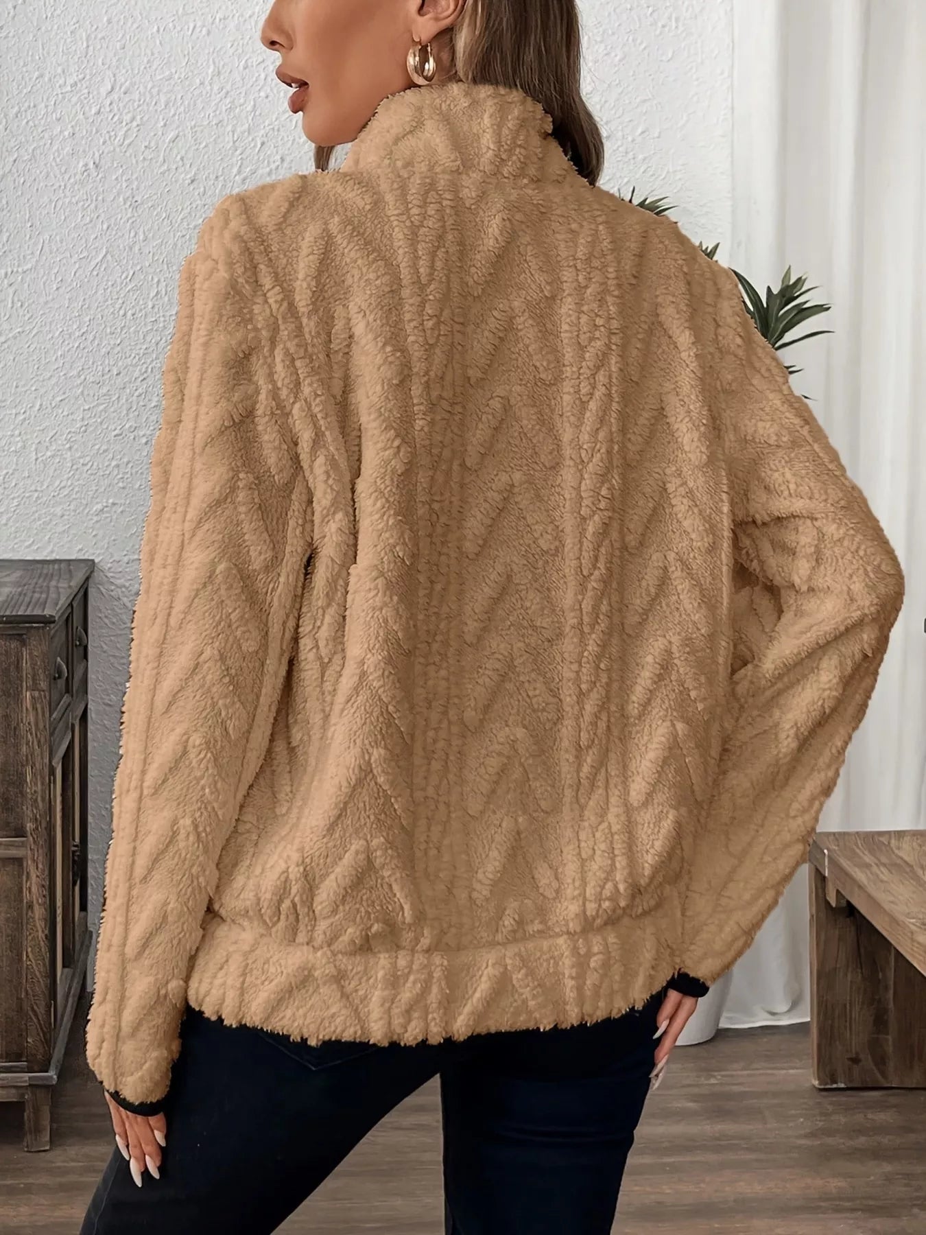 Beige fuzzy knit sweater with high collar and cable-knit pattern