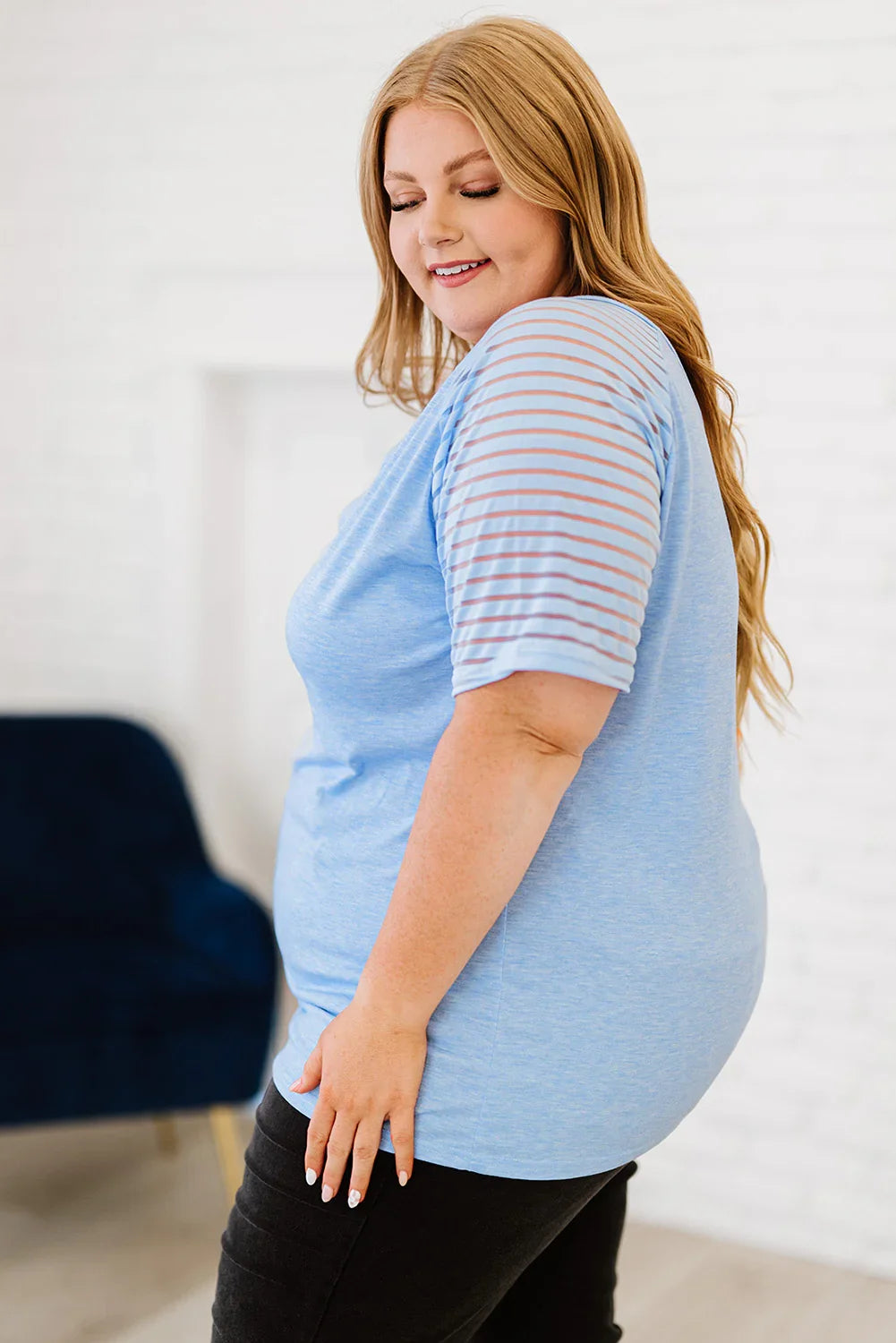 Plus size light blue striped V-neck raglan sleeve tee with black leggings