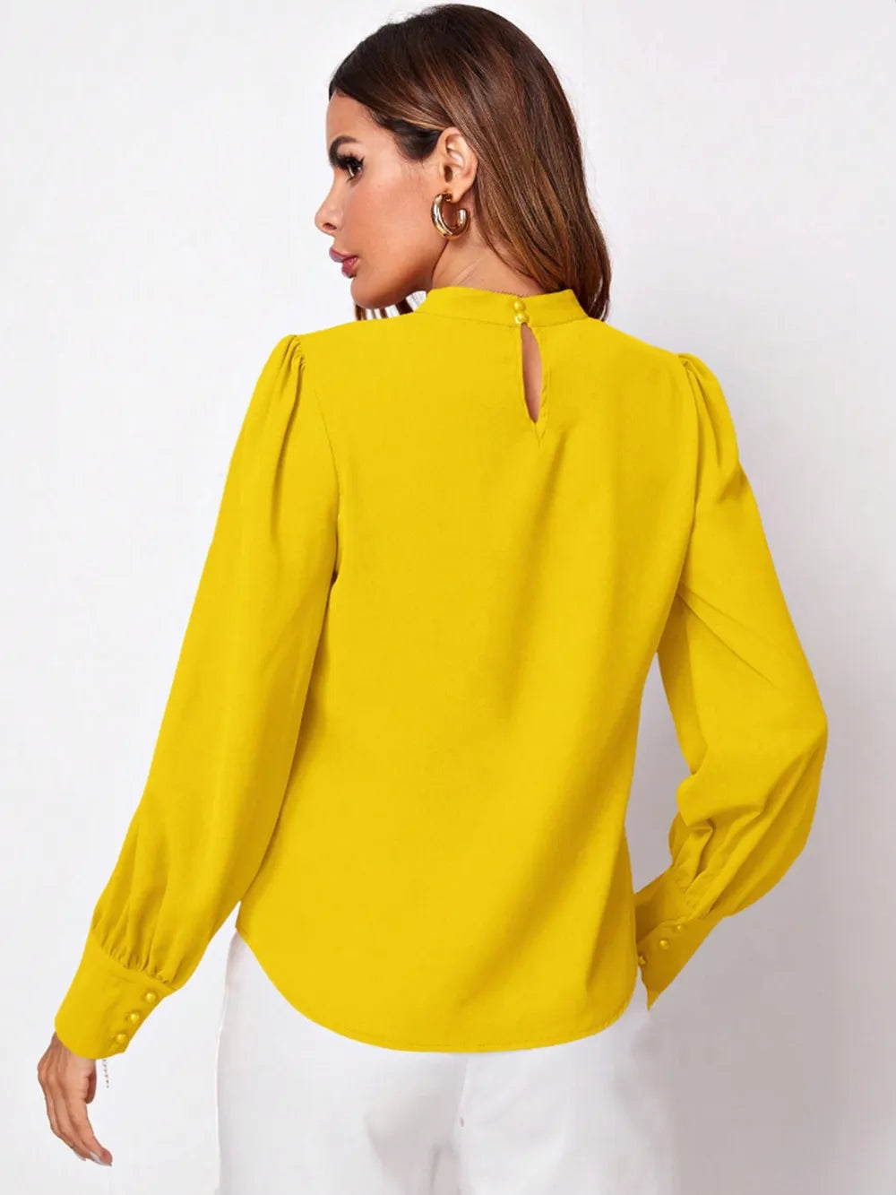 Bright yellow ruched mock neck long sleeve blouse with puffed shoulders