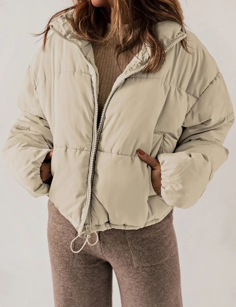 Beige zip-up collared puffer jacket with hood and fleece lining