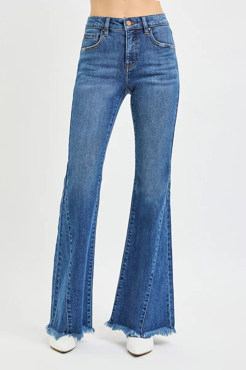 RISEN mid rise flare jeans in blue denim with frayed hem
