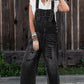Black distressed wide-leg denim overalls with frayed hem, back view