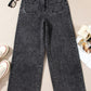 High-waisted wide-leg dark gray washed denim jeans with distressed texture