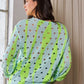 Vibrant Davi & Dani two-tone ribbed hem openwork knit top in neon green, light blue, diagonal stripes, and black polka dots