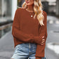 Brown round neck drop shoulder sweater over denim shorts